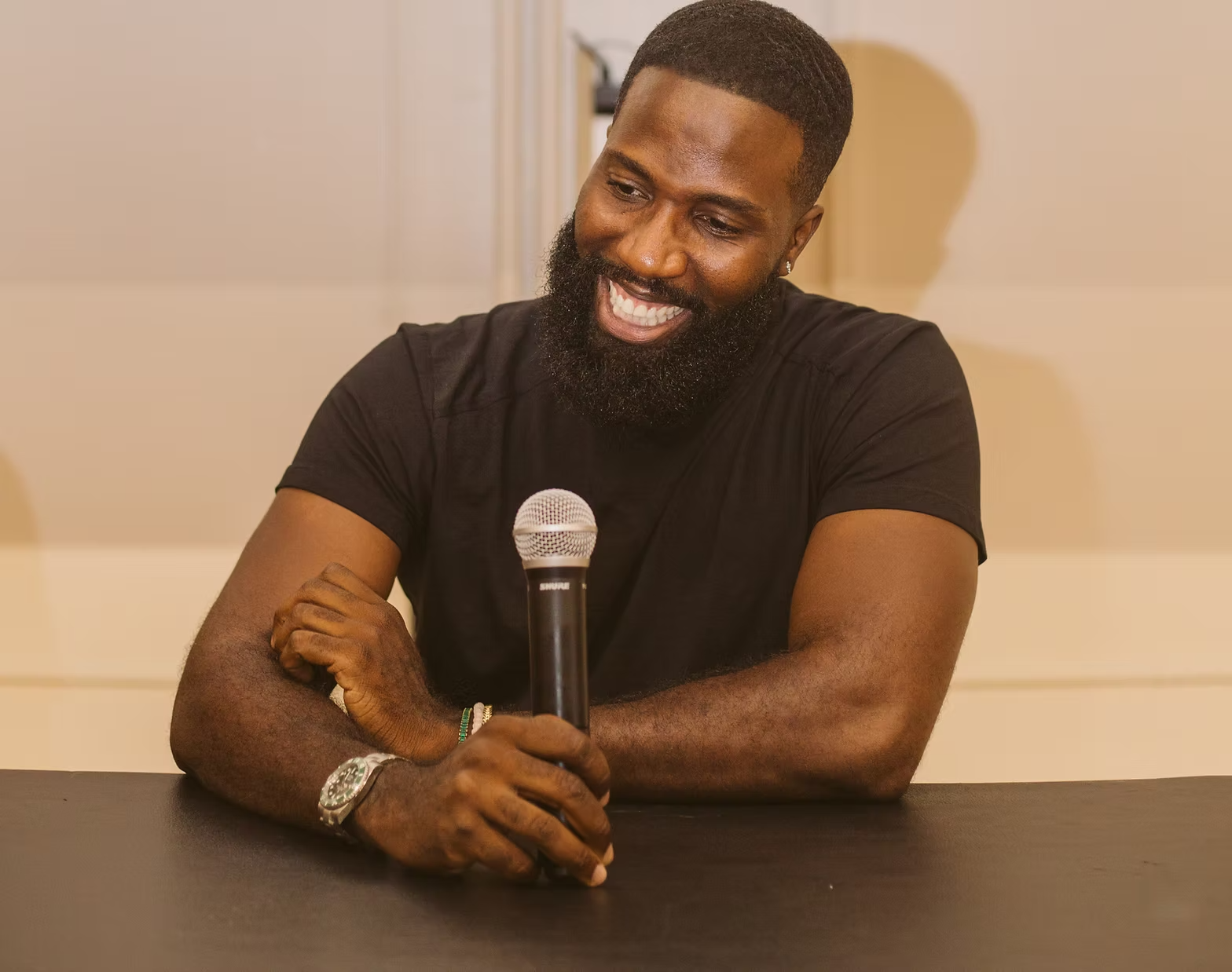 Tarus D. Stills speaking with a microphone
